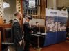 Trade Fair & Exhibition Photographer in Berlin Guests trying a virtual reality demonstration beside a branded exhibitor banner