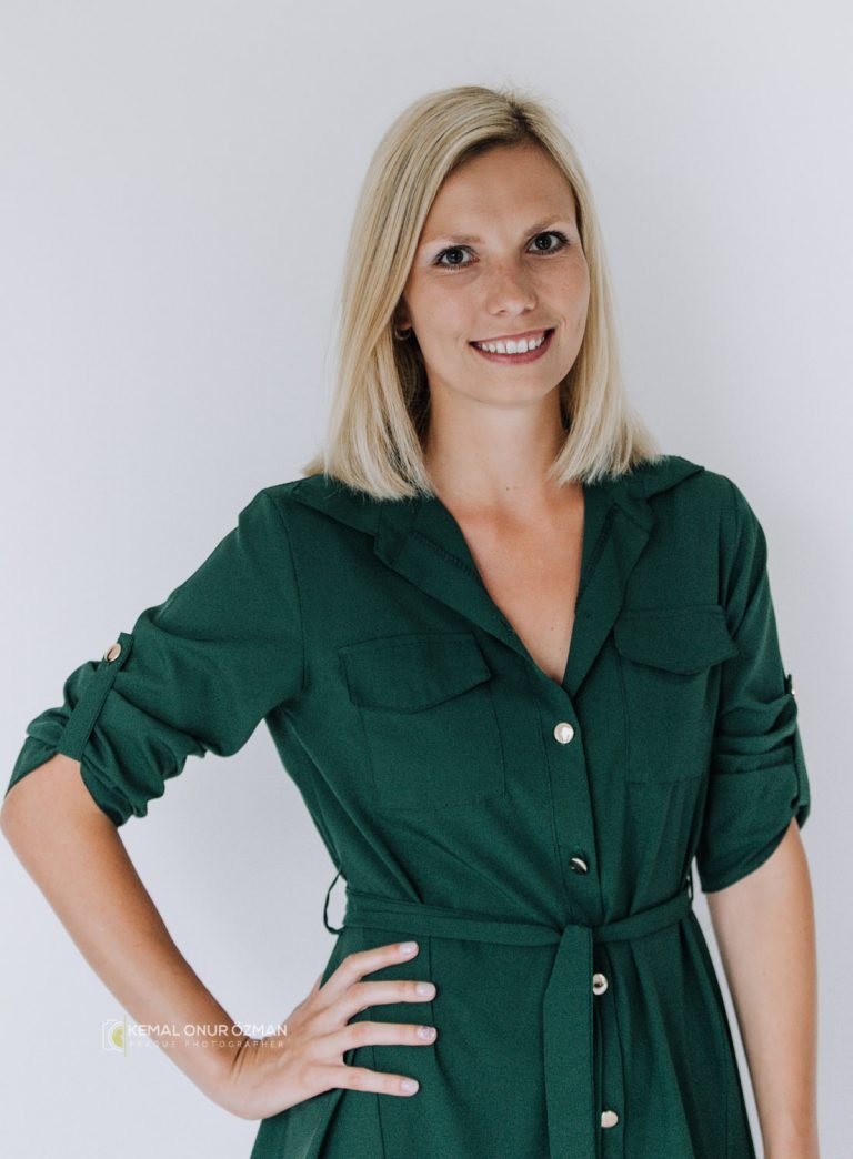 Corporate headshot of a smiling woman against a clean light background